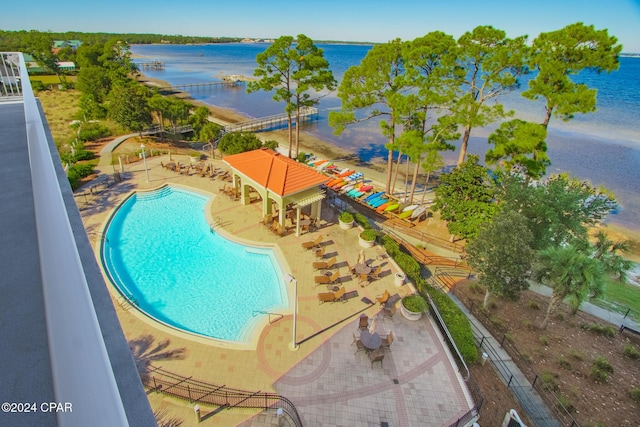 view of pool featuring a water view