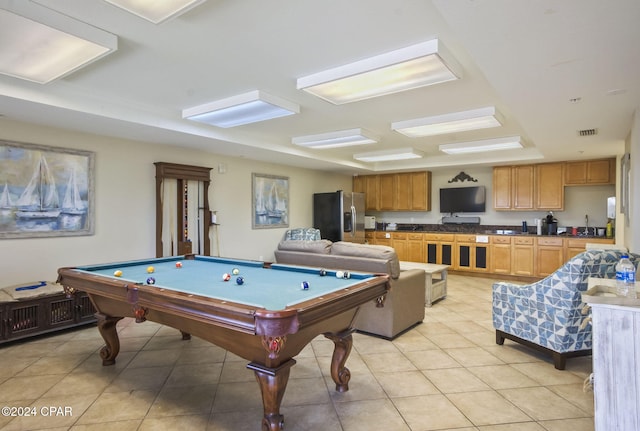 rec room featuring light tile patterned floors, sink, and pool table