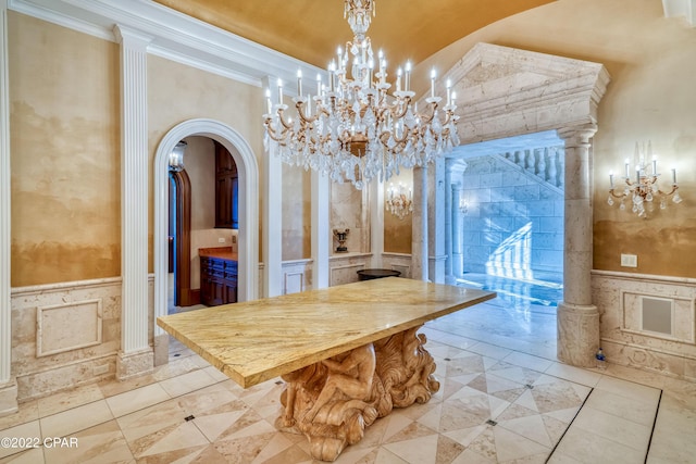 3730 Preserve Bay Blvd, Panama City, FL 32408 - dining space with ornate columns, crown molding, light tile patterned flooring, and a chandelier