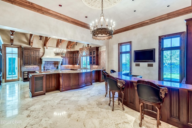 3730 Preserve Bay Blvd, Panama City, FL 32408 - kitchen with a chandelier, a wealth of natural light, pendant lighting, and a kitchen breakfast bar