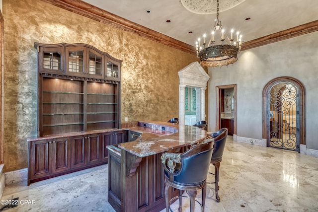 3730 Preserve Bay Blvd, Panama City, FL 32408 - interior space with ornamental molding, dark stone counters, built in shelves, a chandelier, and hanging light fixtures