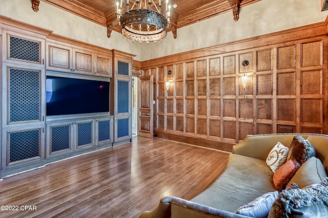 3730 Preserve Bay Blvd, Panama City, FL 32408 - living room with hardwood / wood-style floors, a chandelier, a high ceiling, and ornamental molding