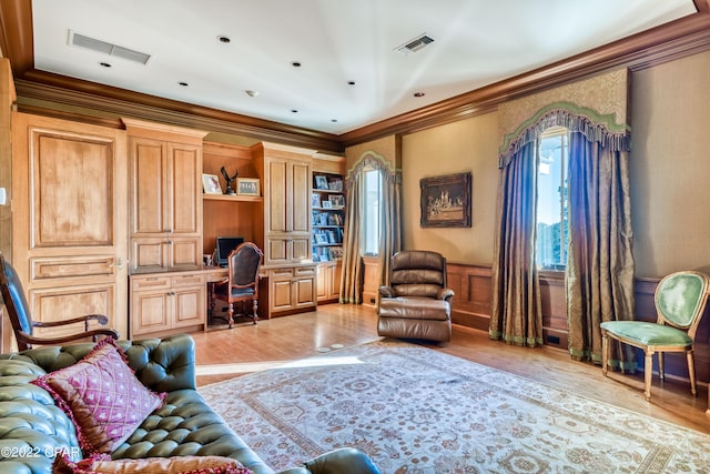3730 Preserve Bay Blvd, Panama City, FL 32408 - living room with crown molding, built in desk, and light wood-type flooring