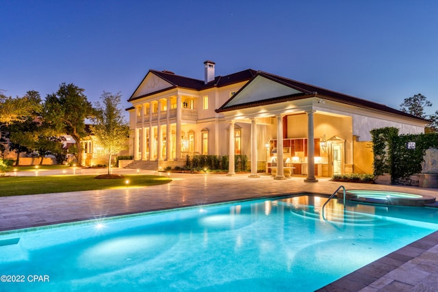 3730 Preserve Bay Blvd, Panama City, FL 32408 - pool at dusk with an in ground hot tub and a patio