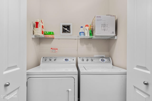 clothes washing area featuring washer and clothes dryer