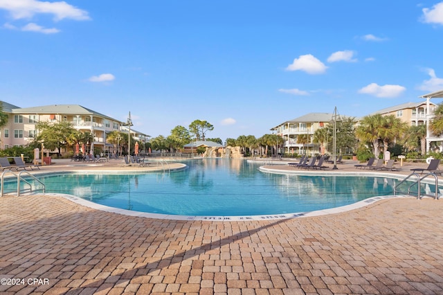 view of swimming pool with a patio area