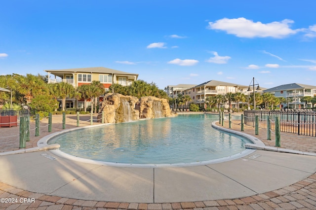 view of pool featuring pool water feature