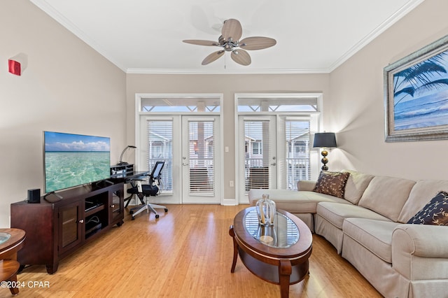 living room featuring ceiling fan, french doors, ornamental molding, and light wood-type flooring