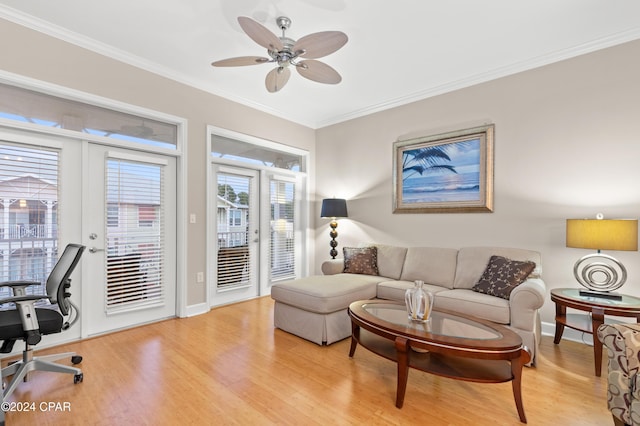 living room with french doors, light wood-type flooring, ceiling fan, and ornamental molding