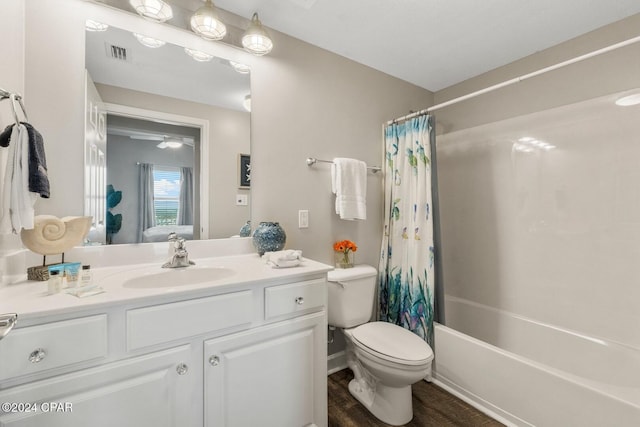 full bathroom with vanity, toilet, wood-type flooring, and shower / tub combo with curtain