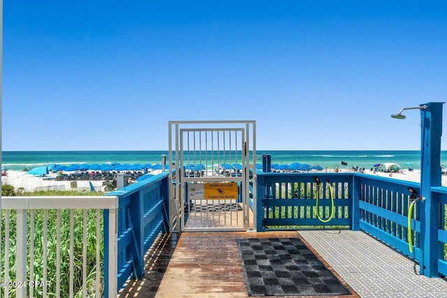 exterior space with a water view and a view of the beach