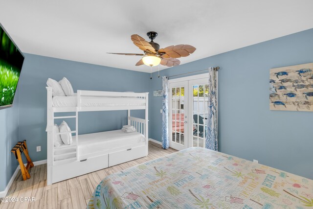 bedroom with wood-type flooring, french doors, and ceiling fan