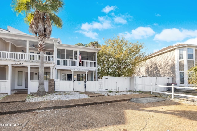 view of front of property featuring a sunroom