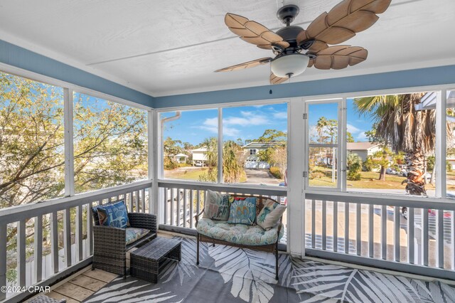 sunroom / solarium with ceiling fan