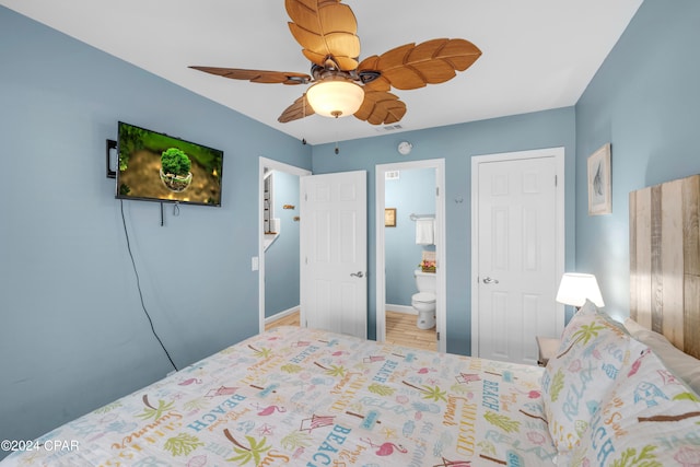 bedroom featuring connected bathroom, ceiling fan, and hardwood / wood-style flooring