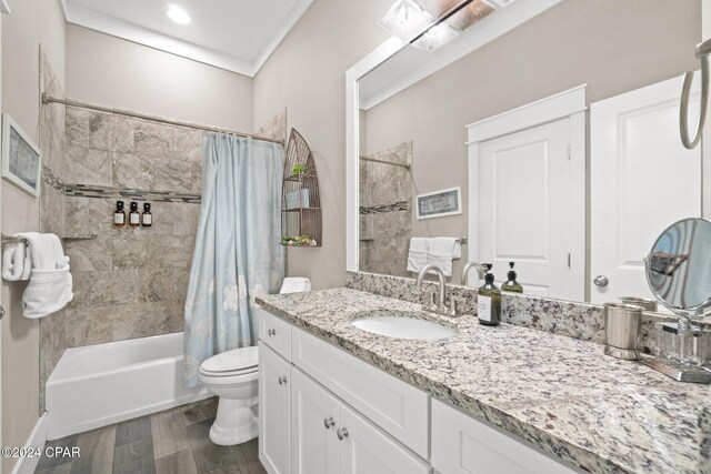 full bathroom featuring toilet, vanity, shower / bath combo, and hardwood / wood-style flooring