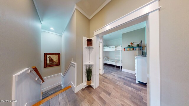 hallway with hardwood / wood-style flooring