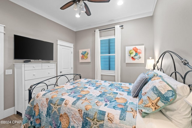 bedroom with ceiling fan and hardwood / wood-style floors