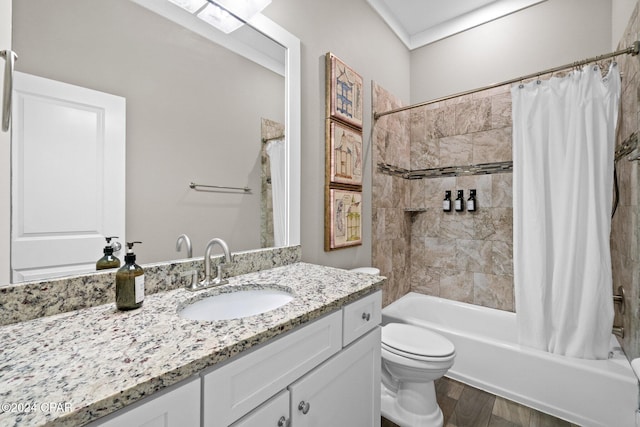 full bathroom featuring hardwood / wood-style floors, vanity, shower / tub combo, and toilet