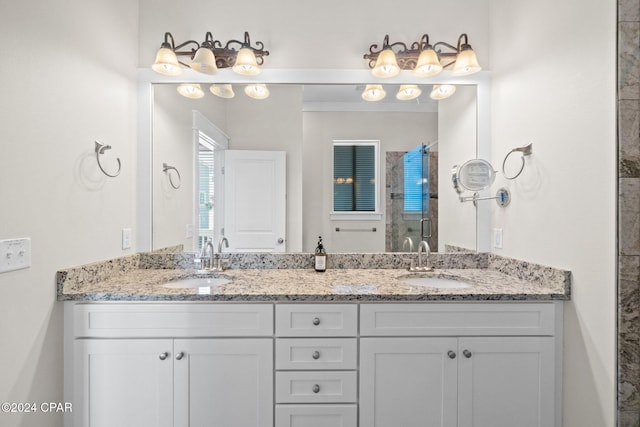 bathroom featuring vanity and an enclosed shower