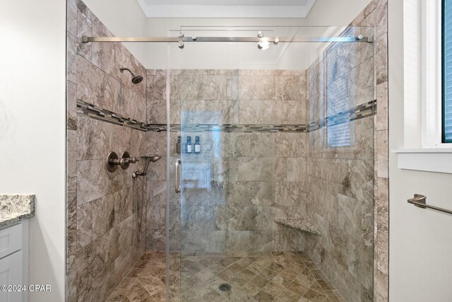 bathroom with vanity and a shower with door