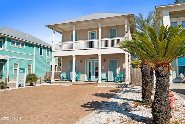 view of front facade with a porch and a balcony