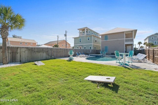 view of yard featuring a patio and a pool