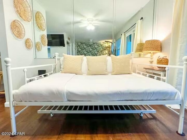 bedroom featuring ceiling fan and wood-type flooring