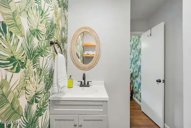 bathroom featuring hardwood / wood-style floors and vanity