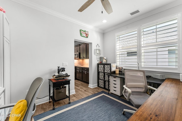 office area featuring dark hardwood / wood-style floors, ceiling fan, and ornamental molding