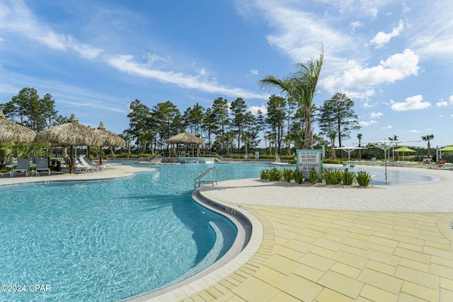 view of swimming pool featuring a gazebo and a patio area