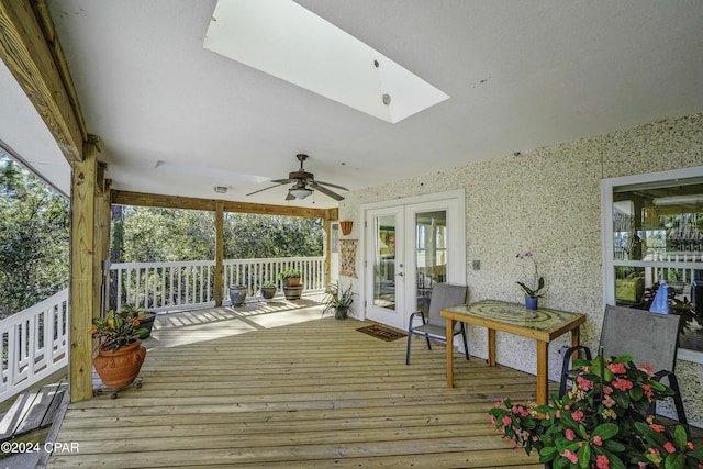 wooden terrace with ceiling fan and french doors