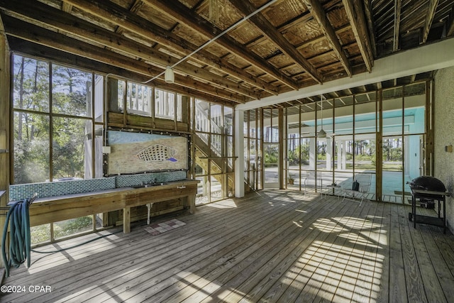 unfurnished sunroom featuring a healthy amount of sunlight