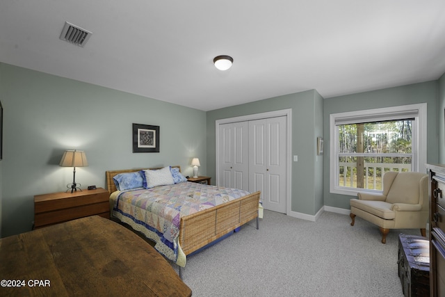 bedroom with carpet floors and a closet