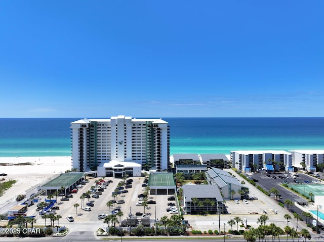 drone / aerial view featuring a water view and a beach view