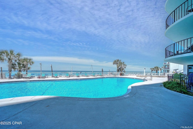 pool featuring a patio and fence