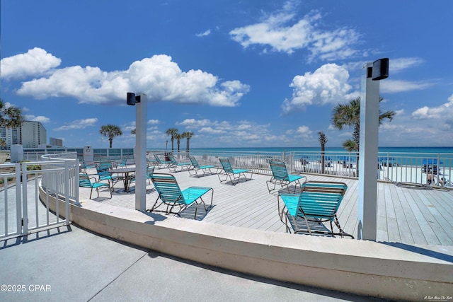 wooden deck featuring a water view