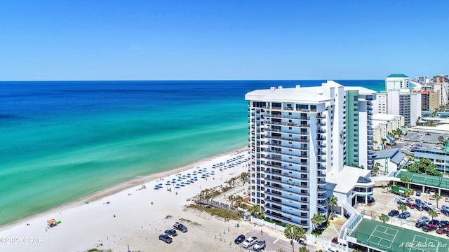 aerial view with a view of the beach, a water view, and a view of city