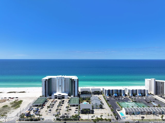 aerial view featuring a beach view, a water view, and a city view