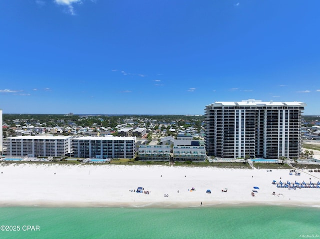 bird's eye view with a view of the beach, a water view, and a view of city