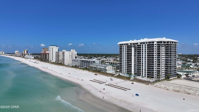 birds eye view of property featuring a city view, a water view, and a beach view