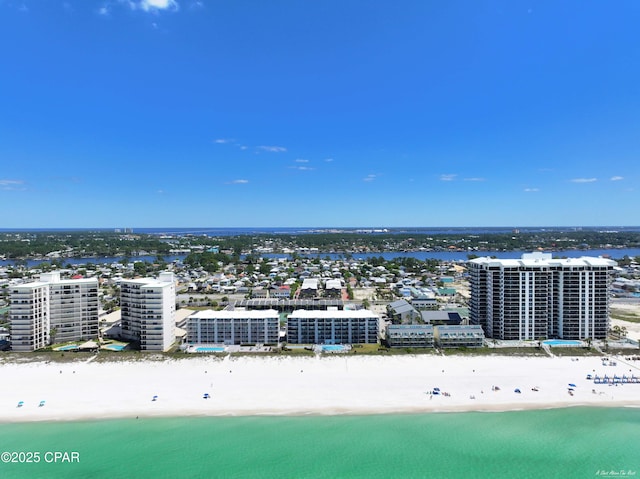 drone / aerial view with a water view, a view of city, and a view of the beach