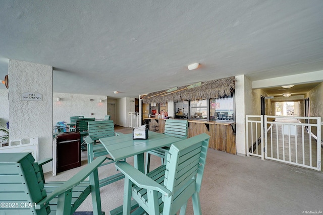 6201 Thomas Dr Unit 1405, Panama City, FL 32408 - carpeted dining space featuring a textured ceiling