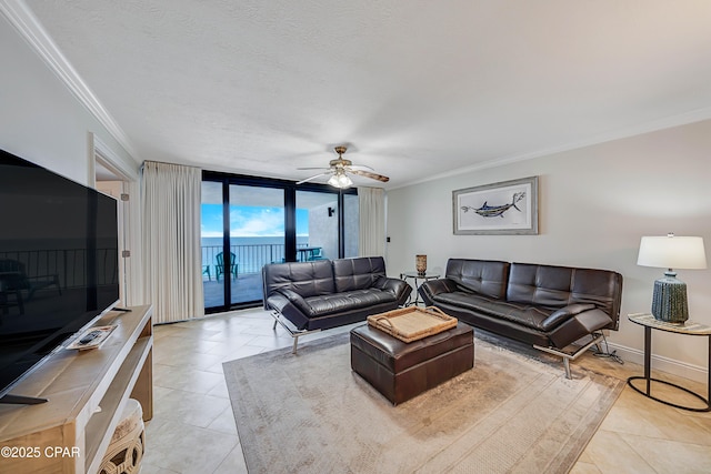 living area featuring floor to ceiling windows, crown molding, ceiling fan, a textured ceiling, and baseboards