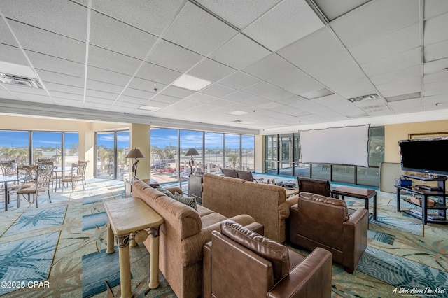 6201 Thomas Dr Unit 1405, Panama City, FL 32408 - living area featuring a drop ceiling, plenty of natural light, and carpet floors
