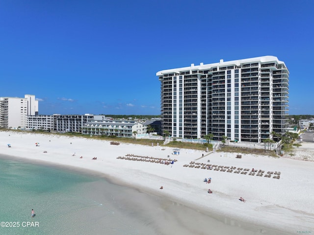 exterior space with a water view and a view of the beach