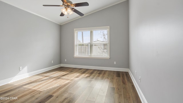 unfurnished room featuring ceiling fan, hardwood / wood-style floors, lofted ceiling, and ornamental molding