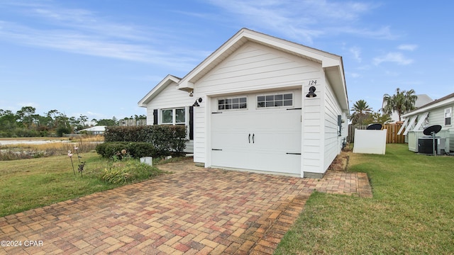 exterior space with a front yard and a garage