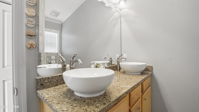 bathroom featuring vanity and crown molding