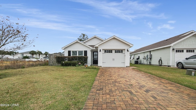 view of front facade with a front yard and a garage